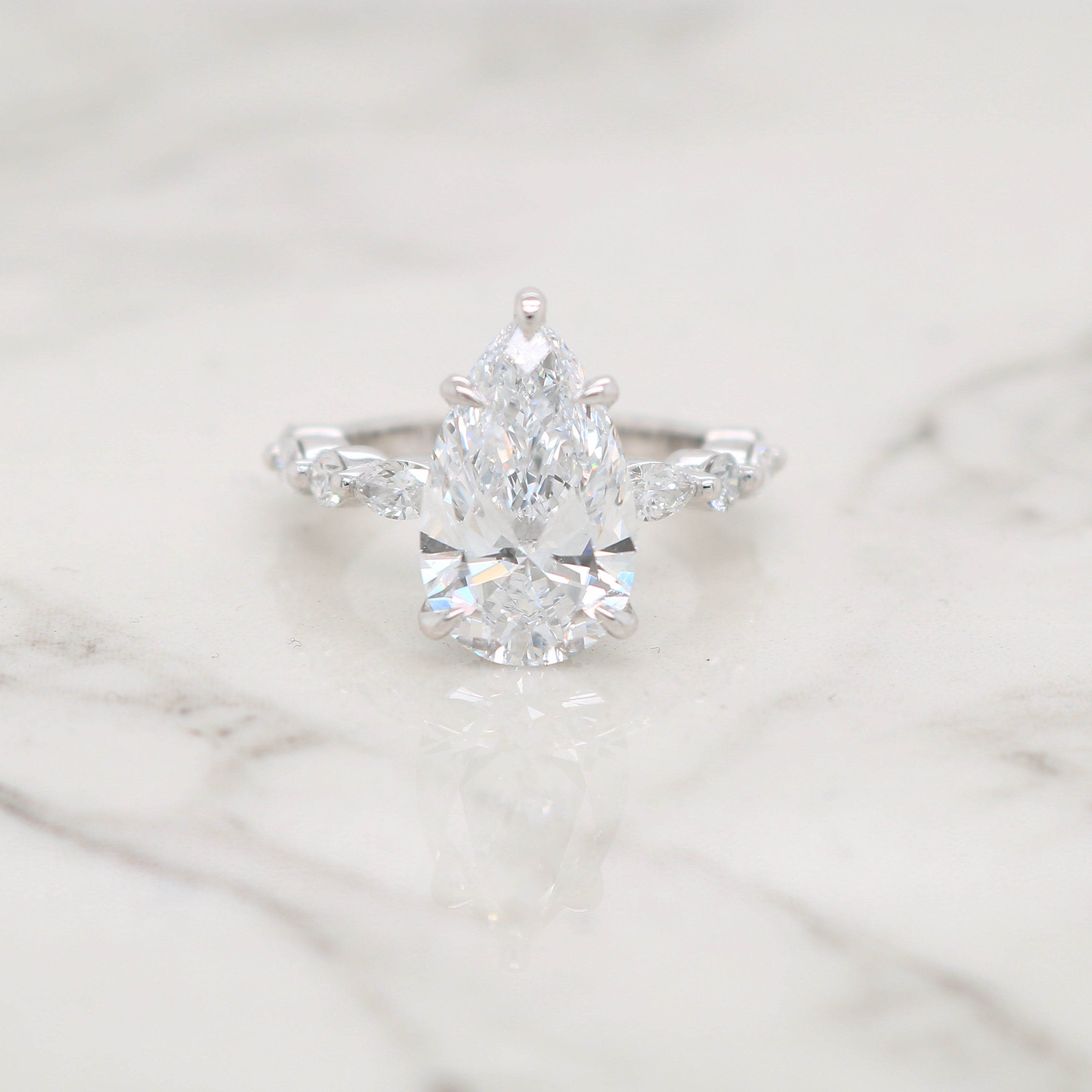 Pear Engagement Ring with Round and Marquise Diamond Band