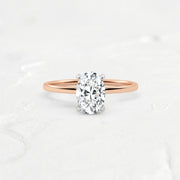 hidden-halo-oval-engagement-ring#metal_18k-rose-gold-w-platinum-head