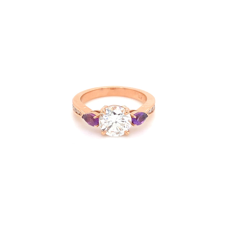 Diamond ring with purple shops side stones